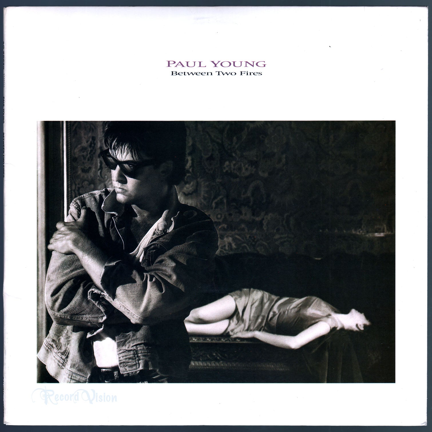 Paul Young - Between Two Fires (front cover) Vinyl