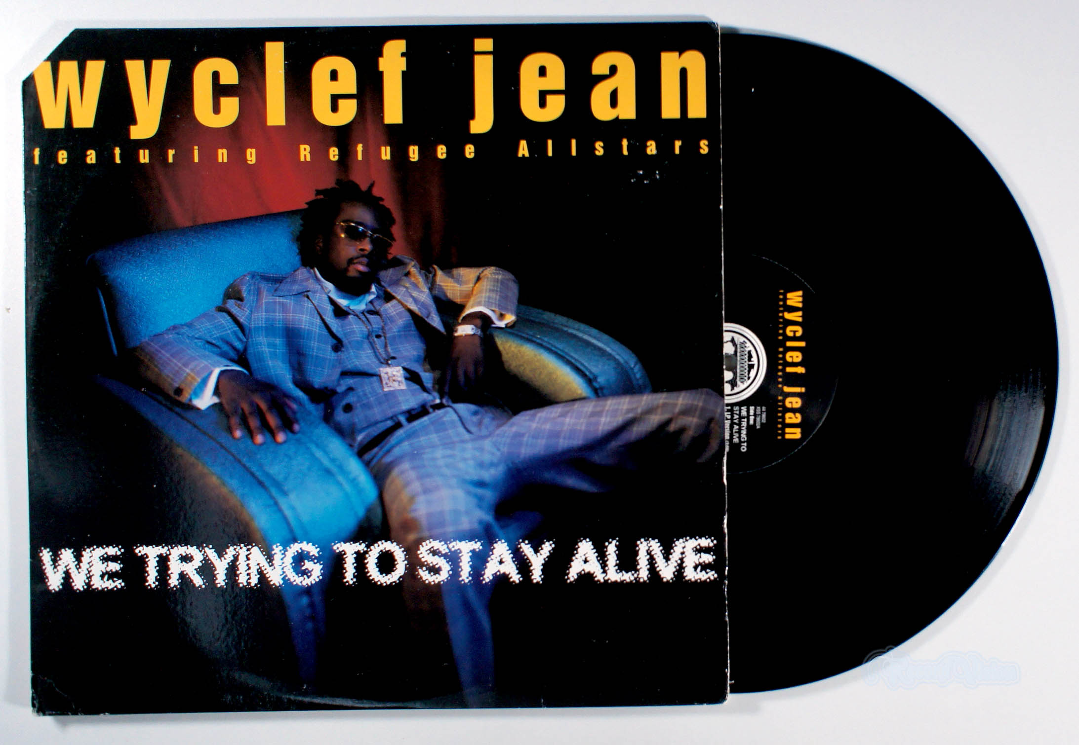Wyclef Jean - We Trying To Stay Alive (12" Single) (front cover) Vinyl